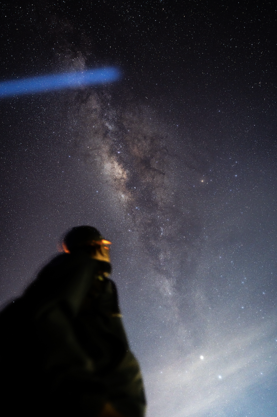 Guest silhouette beneath the Milky Way galactic core in Bali