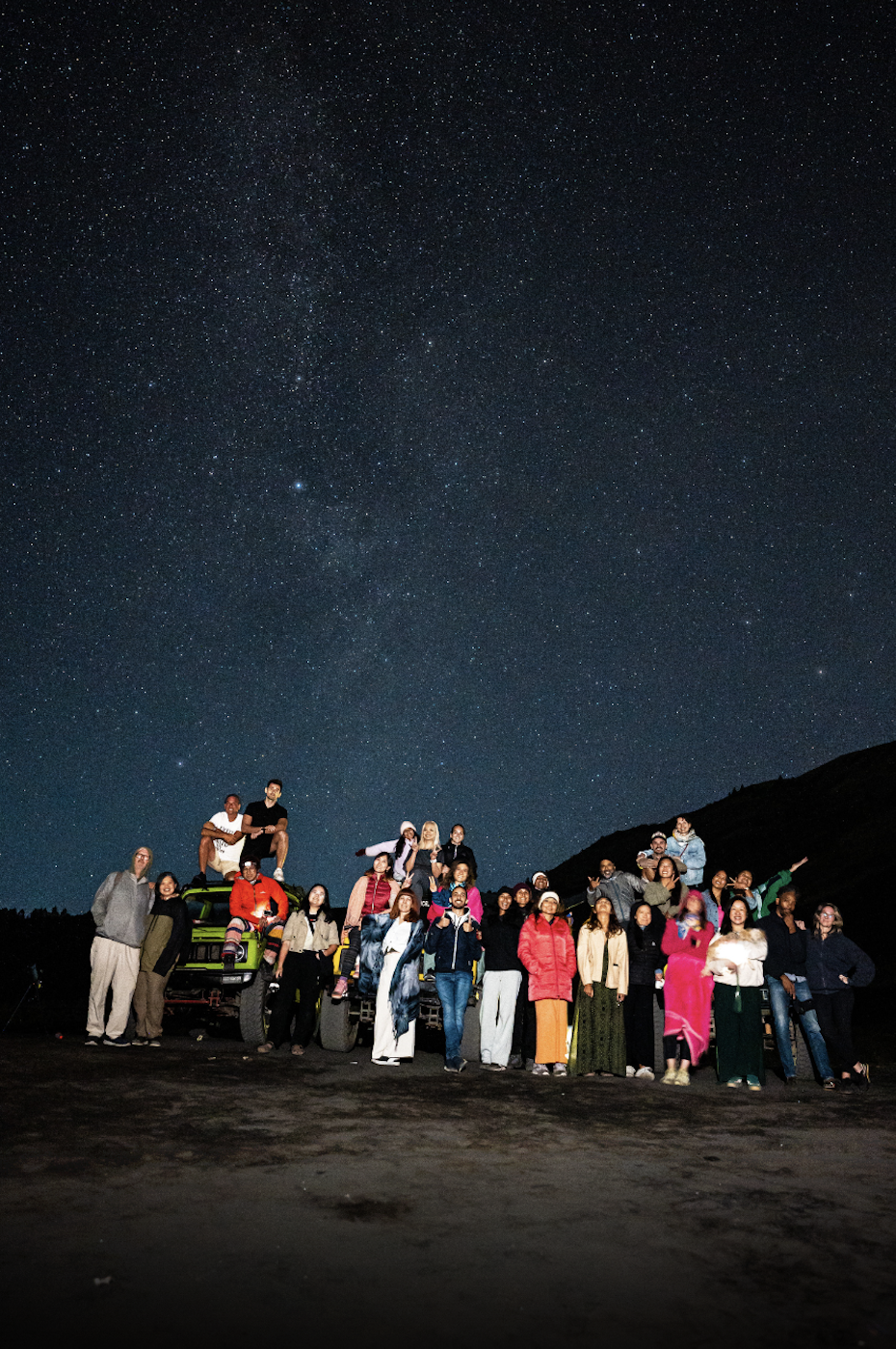 Group photo of guests under the stars at Mount Batur